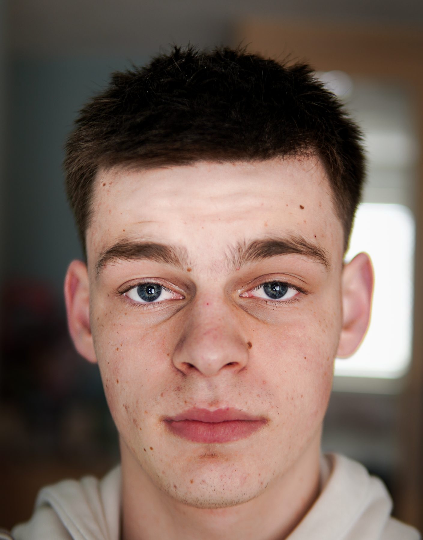 Close-up portrait of a young man with a calm expression